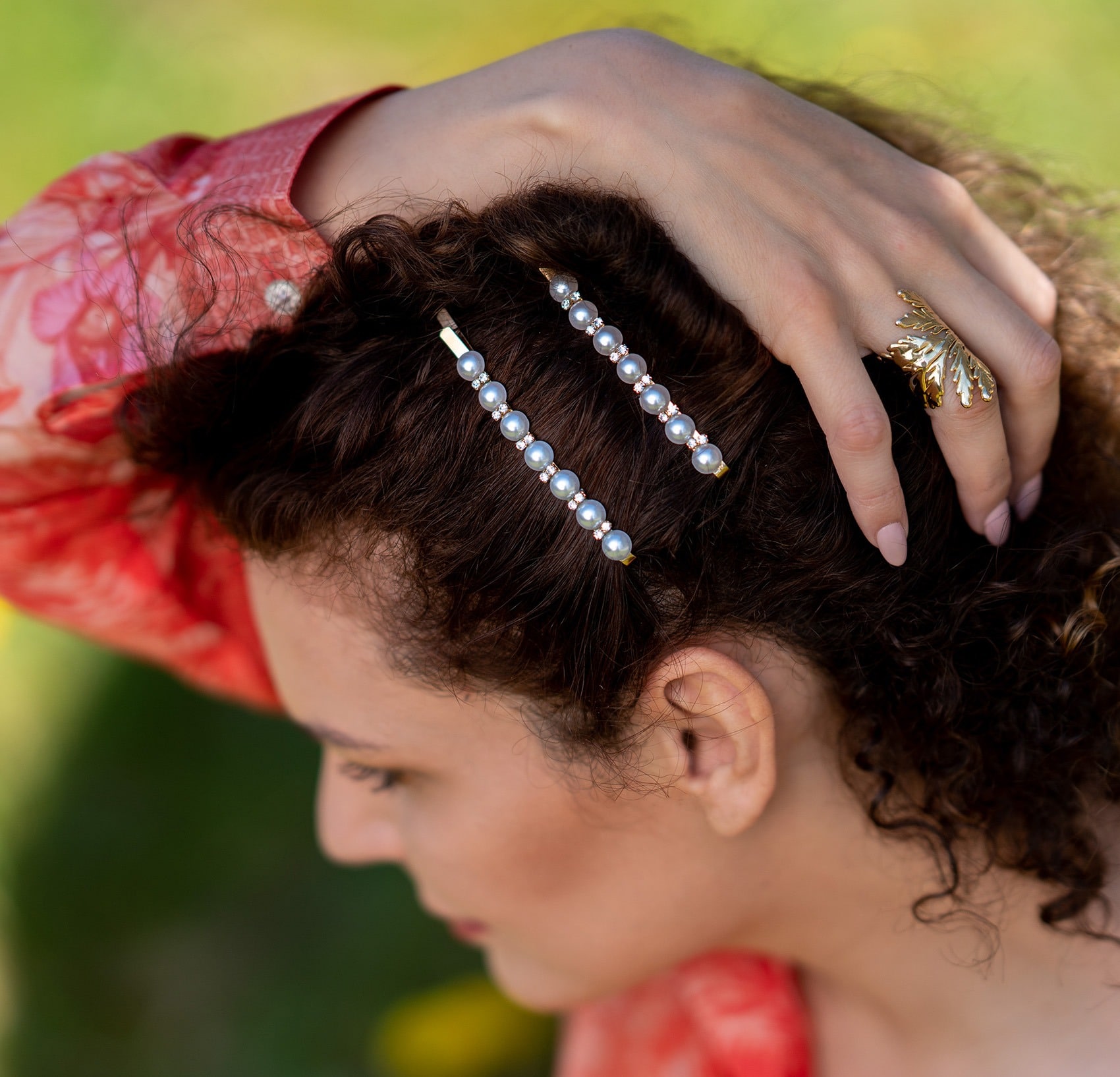 Curly hair and gold hair clip