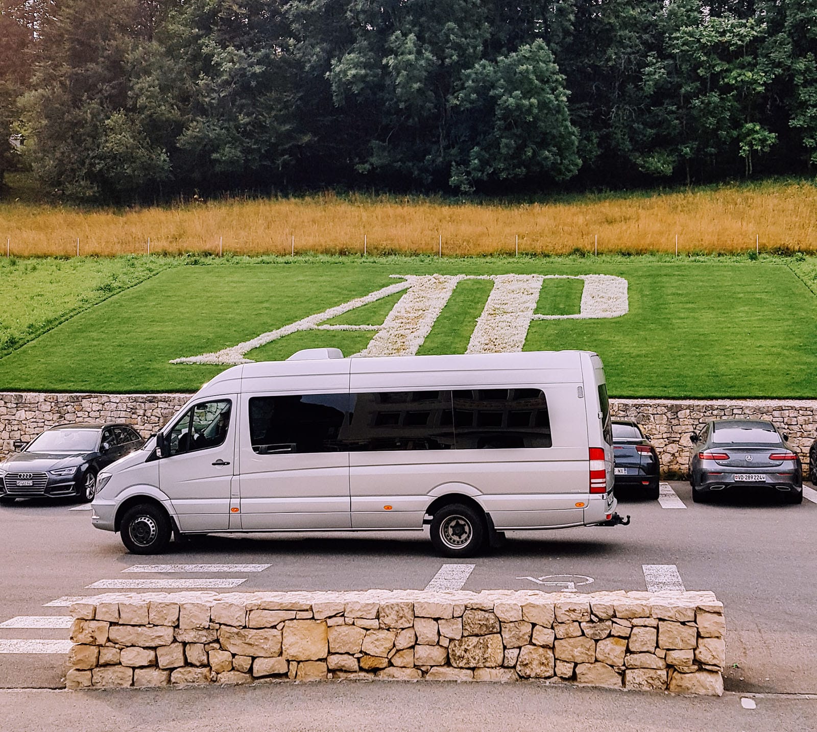 Luxury van in front of Audemars Piguet lawn