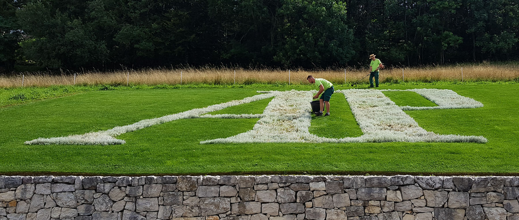 Audemars Piguet initials on lawn outside headquarters in Les Brassus