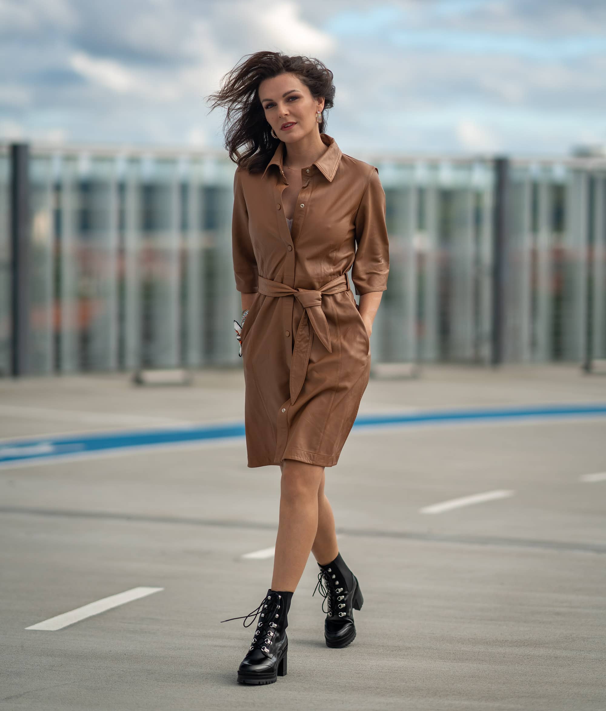 woman in leather dress and chunky shoes