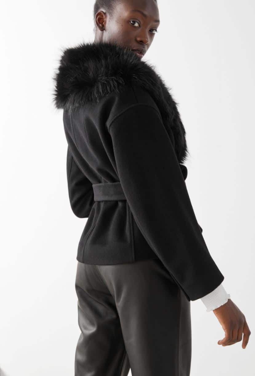 Woman in black fur jacket