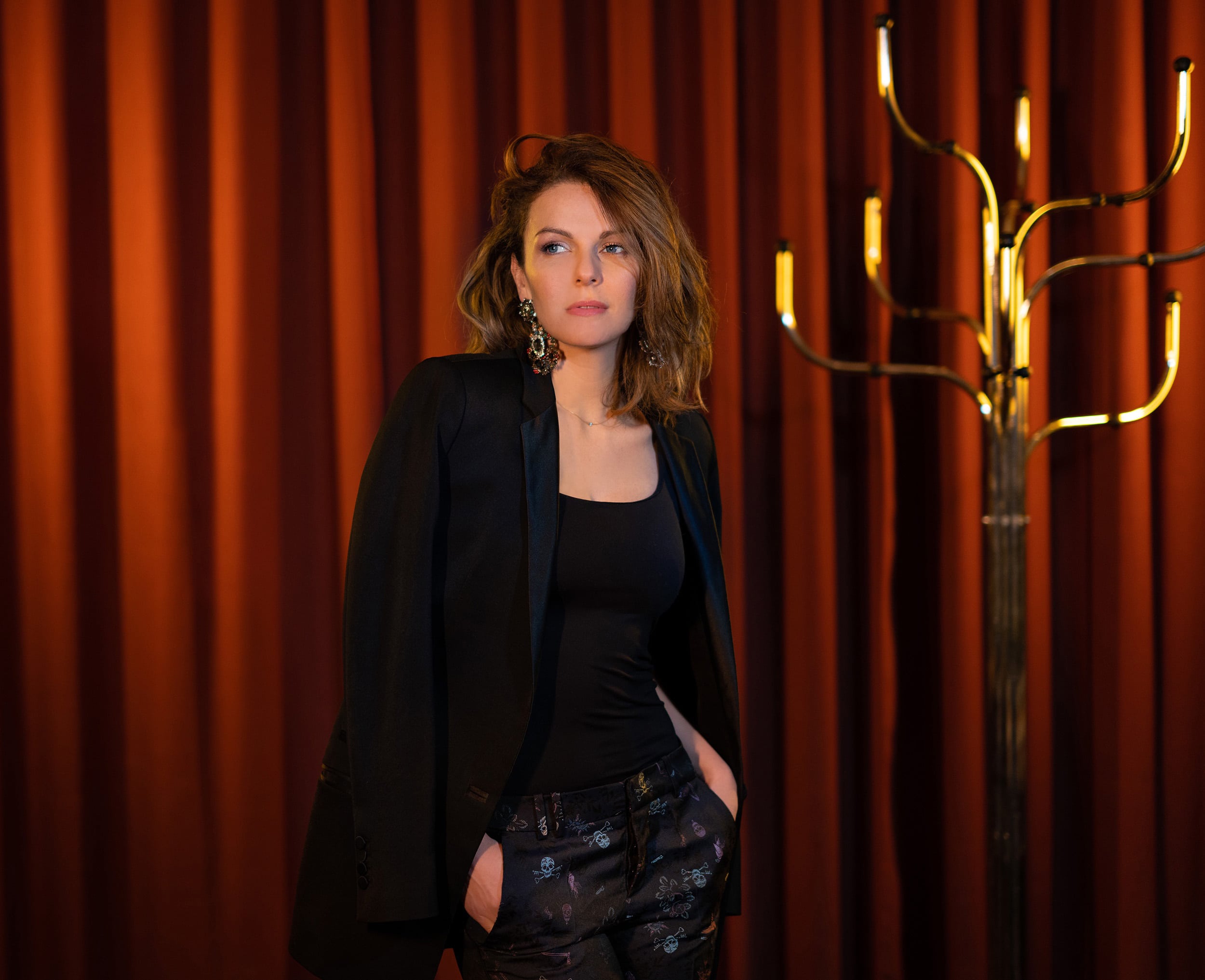 B (11) Girl in black blazer and big earrings