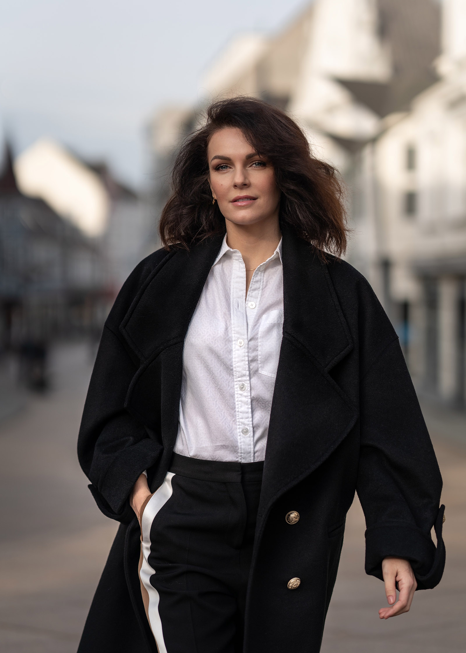 woman in black coat and white burberry shirt