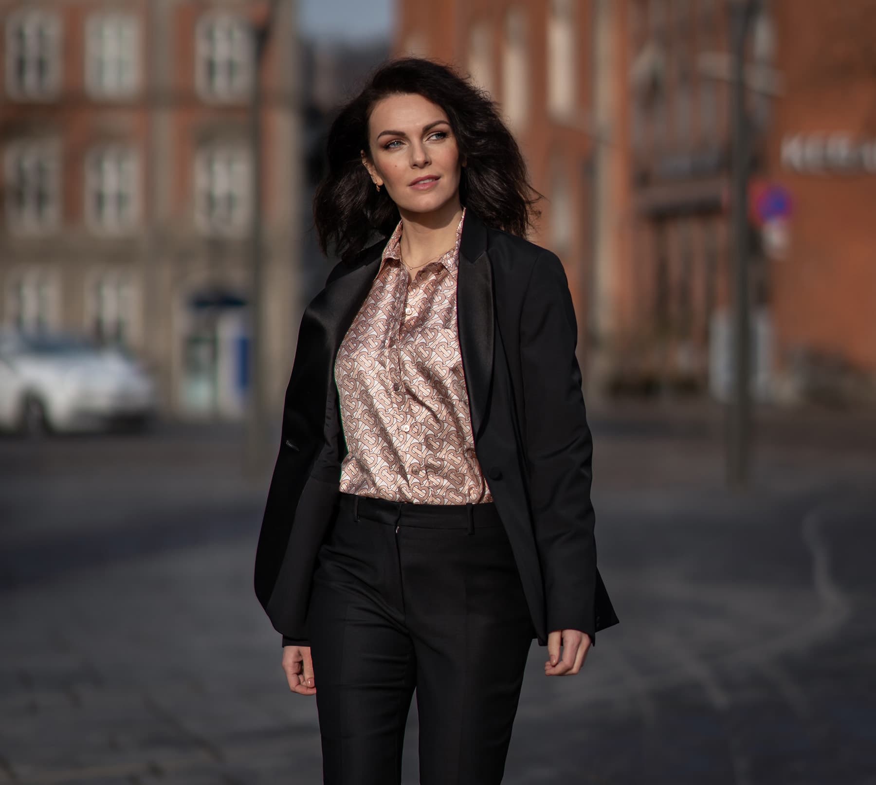 woman in black suit with burberry shirt