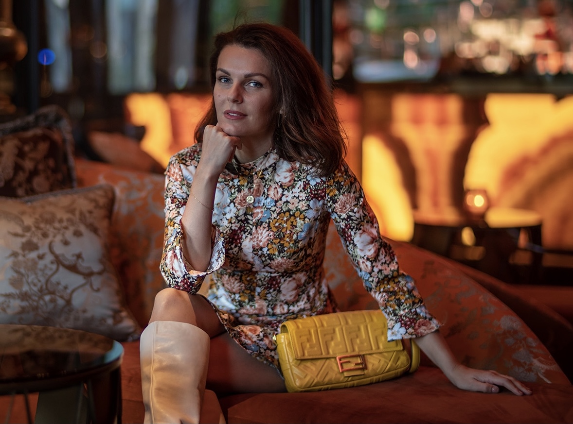 Girl seated in a fancy bar