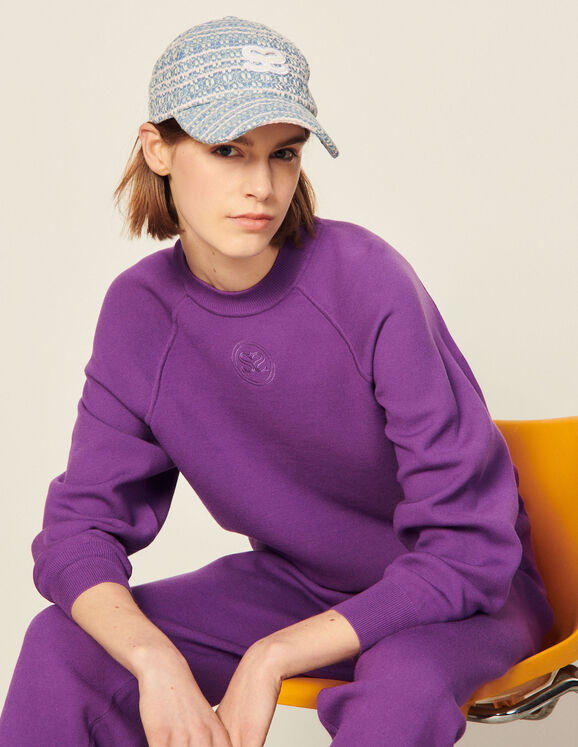 Girl in purple tracksuit