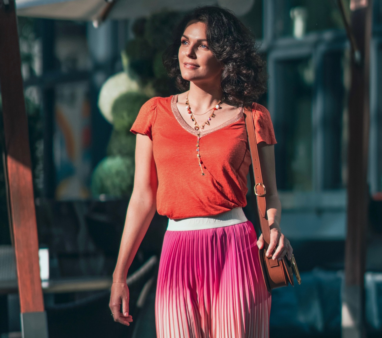 Girl in orange and pink